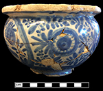 Chamberpot painted with floral motifs. Vessel  likely dates to the late 17th to early 18th centuries. 7.25” rim diameter. Test Unit 1 Lot 187, from 18BA370. 
